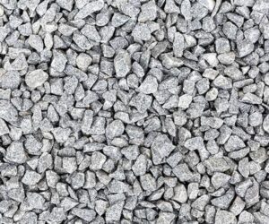 Textura de bica corrida Multilix de alta densidade, mostrando britas cinzas de tamanhos mistos compactadas para base de asfalto.