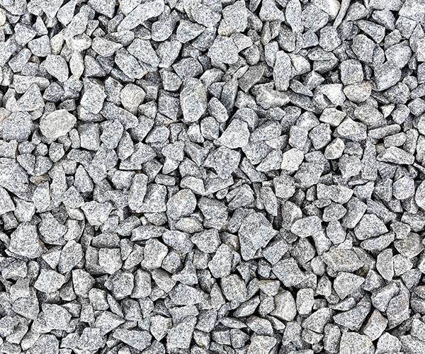 Textura de bica corrida Multilix de alta densidade, mostrando britas cinzas de tamanhos mistos compactadas para base de asfalto.